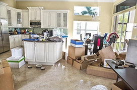 Kitchen full of junk and in need of cleaning.