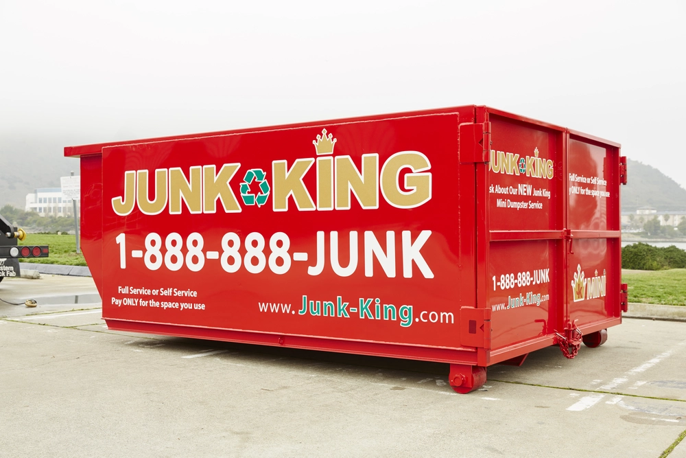 Stacked red bin rentals ready for delivery in the Peninsula area
