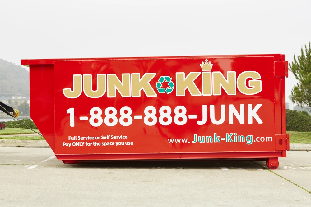 Dumpster rental from Junk King placed at a Belmont home for cleanout project