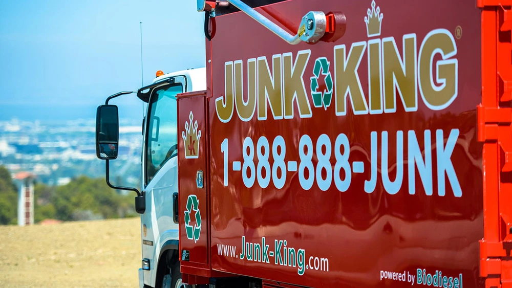 Team loading junk onto a Junk King truck in Ashbury Heights neighborhood