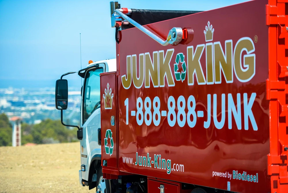Junk King team removing an old hot tub from a backyard in Sunset District