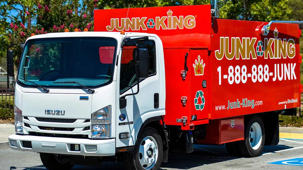 Junk King crew dismantling and hauling away an old hot tub in Portola Valley